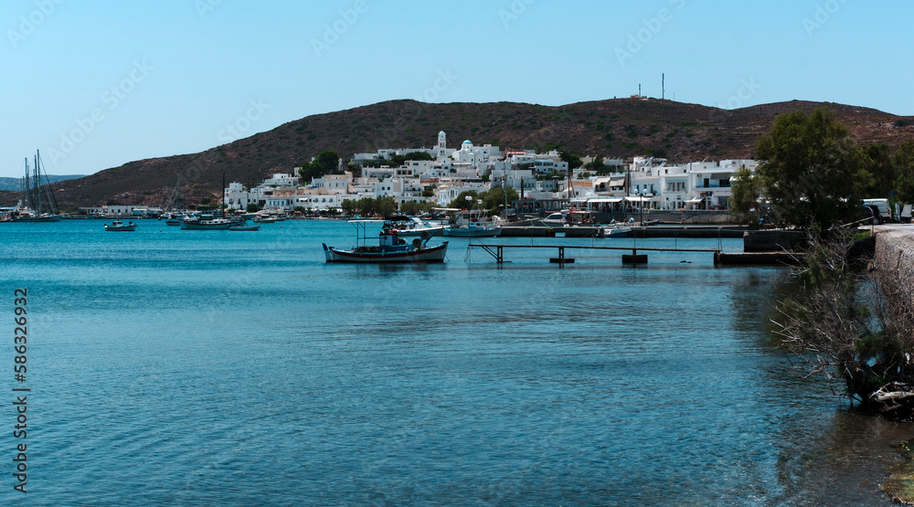 Adamas, Milos Island, Cyclades, Greece view of the beautiful greek white building village from the sea, anchor stop,