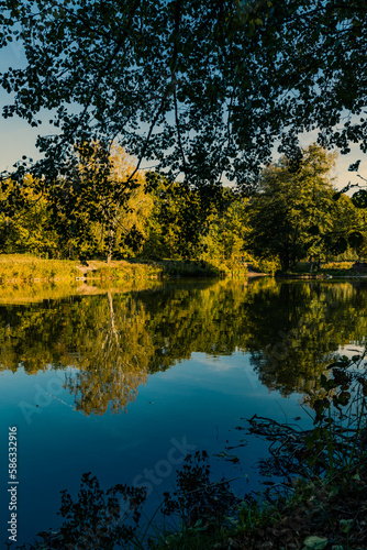 Beautiful autumn panorama of forest and reflections in the lake in Zalesie near Warsaw, Poland  photo