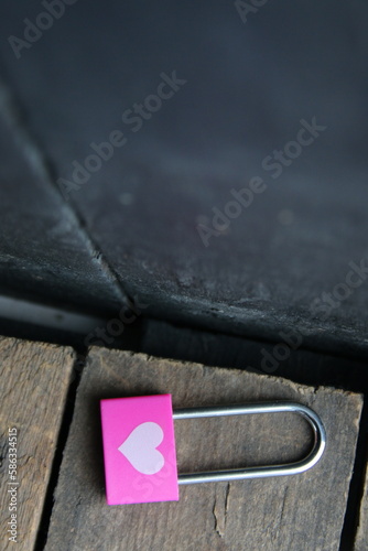 Pink padlock with a heart. Birthday background.