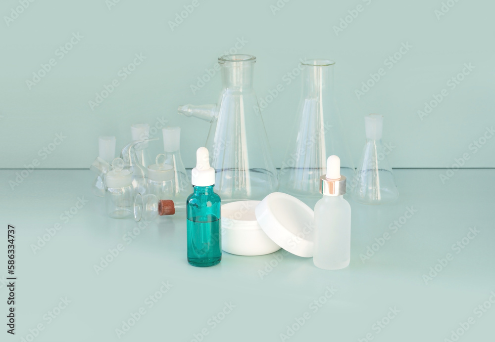 skin serum, moisturizing and whitening serum, fruit acids.Glass Volumetric Flask ,Laboratory Flasksare used for laboratory work in the background skin serum, moisturizing and whitening serum, fruit acids.Glass Volumetric Flask ,Laboratory Flasksare used for laboratory work in the background