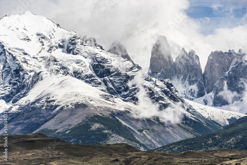 Torres del Paine peaks coming from clouds © Fyle