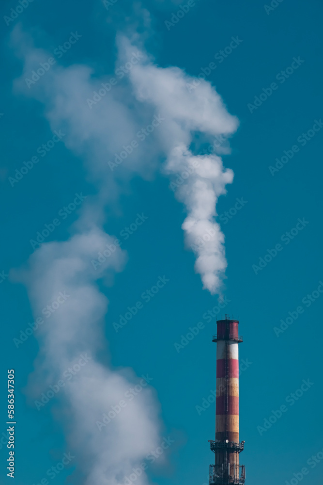 Smoke stack with blue sky on background