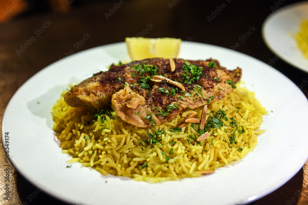 dish of rice with spices with chicken served in a delicious way
dish of rice with spices with chicken served in a delicious way