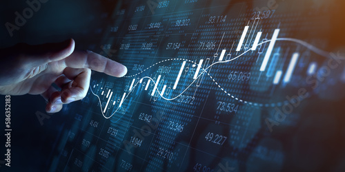 Stock market financial investment and trading graph interface showing ticker price evolution with candlestick chart and moving average curves. Increasing profit. Forex. Person touching virtual screen. photo