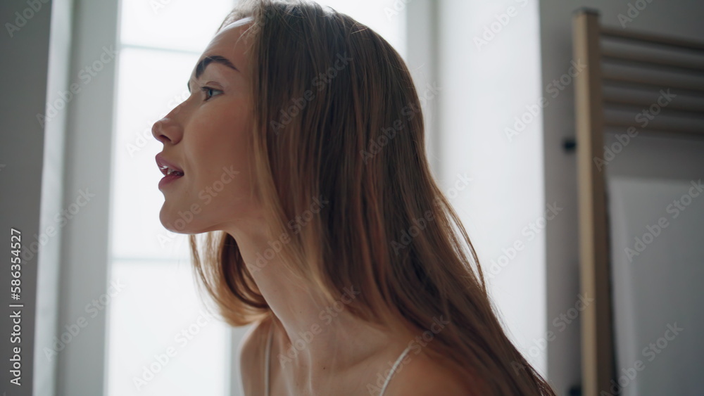 Smiling lady looking mirror at bathroom closeup. Stunning woman beauty routine Smiling lady looking mirror at bathroom closeup. Stunning woman beauty routine