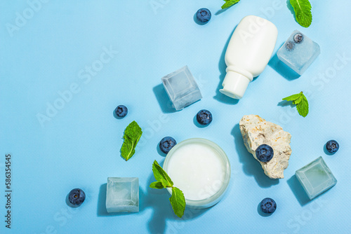 Natural skincare. Cream or lotion with organic berries. Blueberry, mint, and ice. Moisturizing