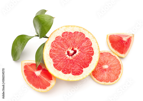 Juicy grapefruits and plant branch on white background