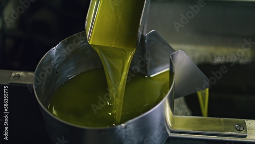 Quadro su tela Olive oil production process at food manufactory close up.