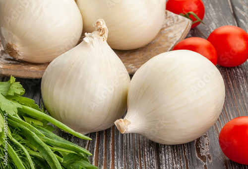 white onions on wood background