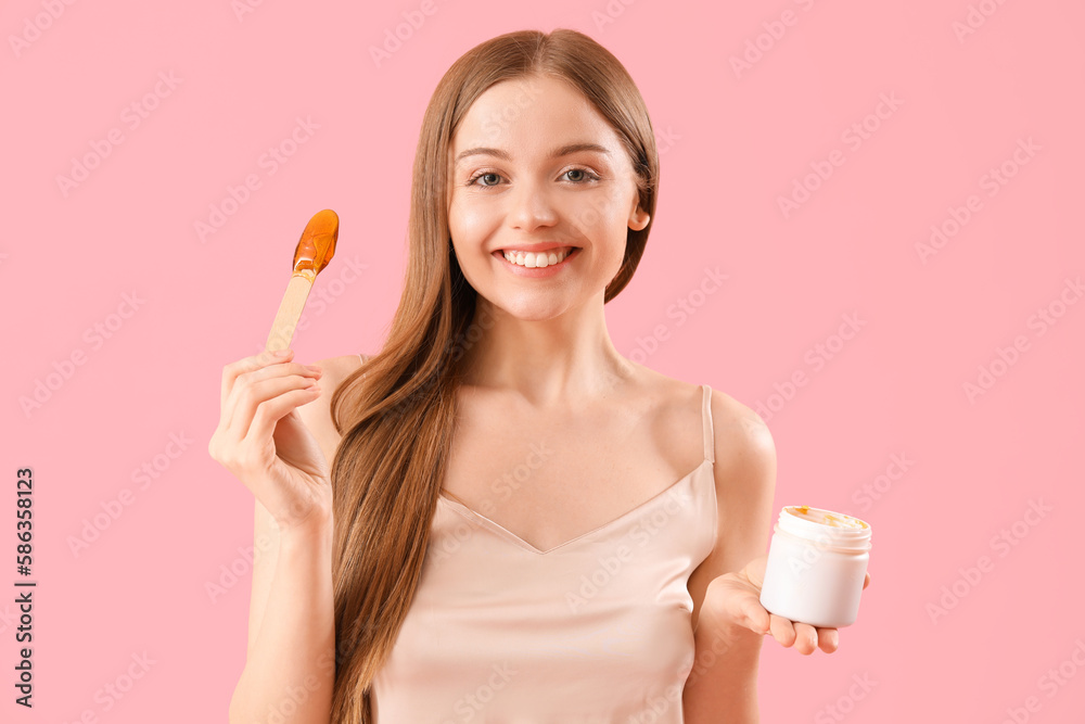 Pretty young woman with sugaring paste on pink background Pretty young woman with sugaring paste on pink background