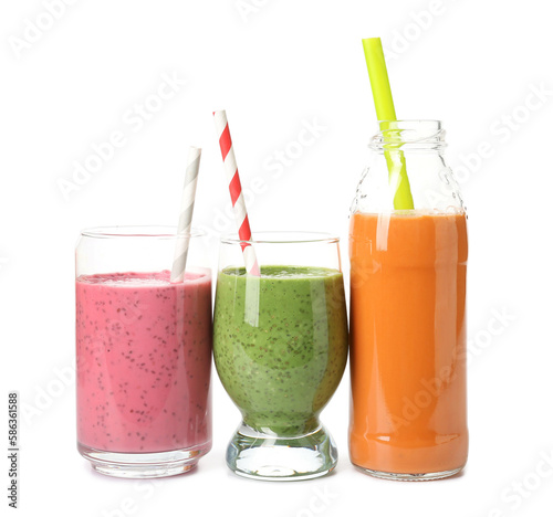 Wallpaper Mural Glasses and bottle of different tasty smoothie with straws on white background Torontodigital.ca