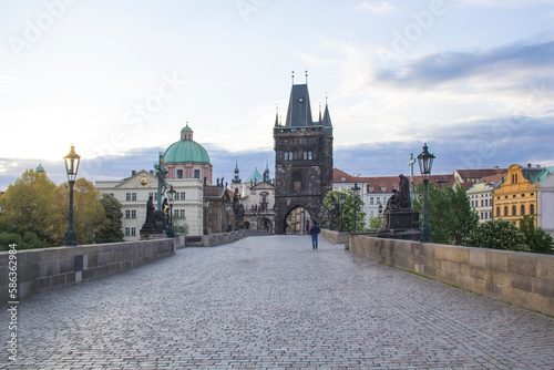 Beautiful view of Old Town Tower of Charles Bridge at dawn in Prague, Czech Republic