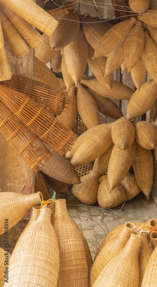 Weaving bamboo fish trap with basket in Hanoi, Vietnam. Weaving bamboo fish trap with basket in Hanoi, Vietnam.
