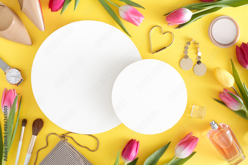 Obraz premium Top view photo of white circles trendy women shoes perfume bottle cosmetics bijouterie handbag modern watches and colorful tulips on light yellow background with blank space. Women's Day concept.