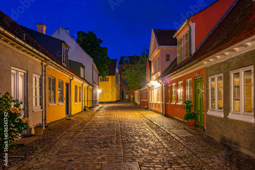Night view of a colorful street in the center of Odense, Denmark