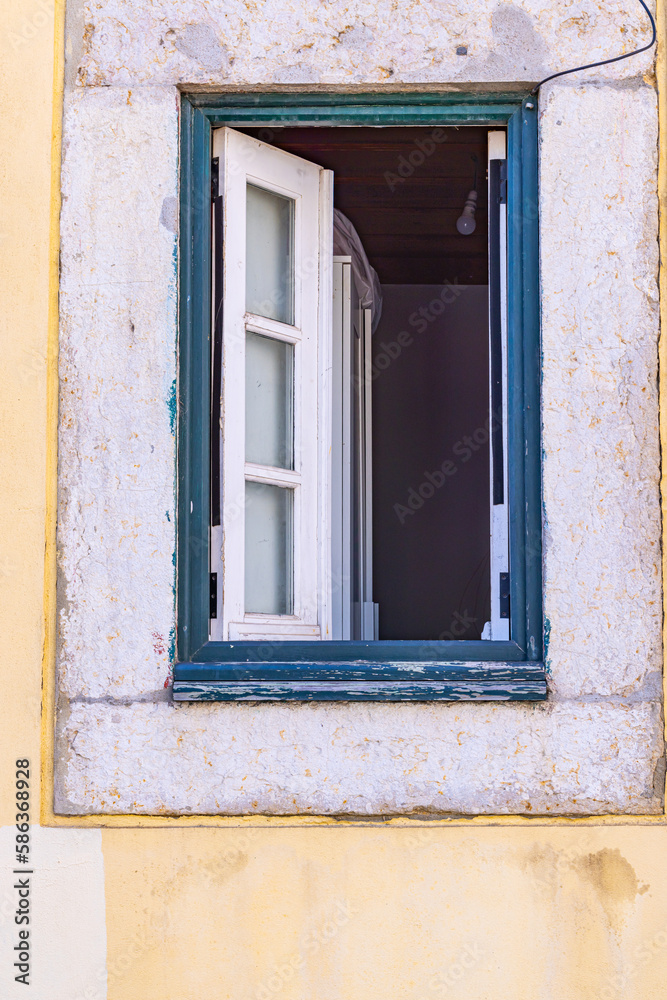 An open window on a building in Lisbon.