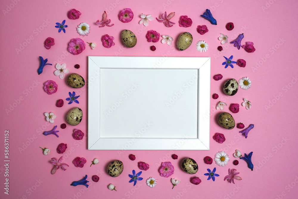 Happy Easter composition. Easter eggs, flowers, photo frame on pink background. Flat lay, top view, copy space, mock up.
