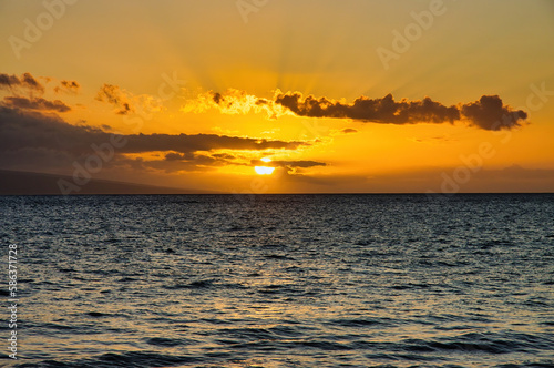 Brillian colors of a golden sunset on maui.