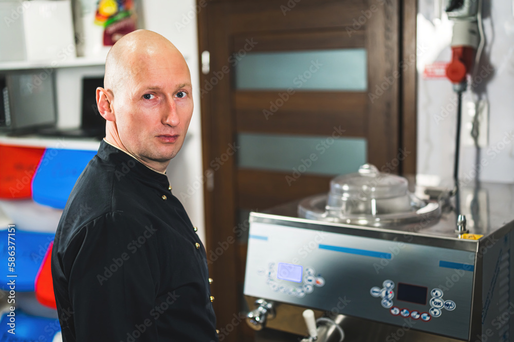 Male pastry chef working with pasteurization machine for ice cream production . High quality photo Male pastry chef working with pasteurization machine for ice cream production . High quality photo