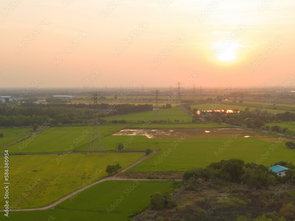 Fototapeta premium Aerial view of electricity generating, voltage poles. Power lines on utility tower and cable wires in energy electric technology, network, and industry. Generator pylon. Transmission and substation.