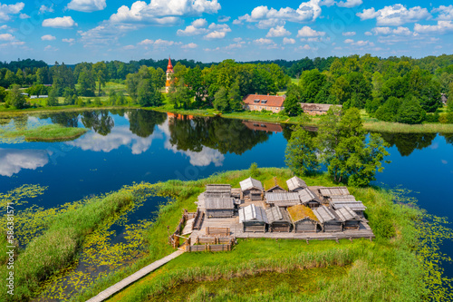 Aerial view of wooden houses at Araisi lake dwelling ethnographic site in Latvia photo