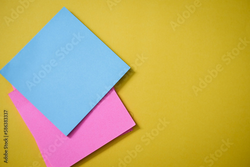 Colorful sticky notes on yellow background 