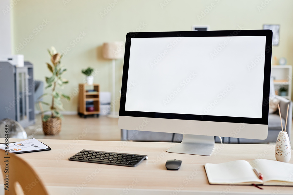 Background image of blank computer screen mockup at workplace desk in home office setting, copy space Background image of blank computer screen mockup at workplace desk in home office setting, copy space