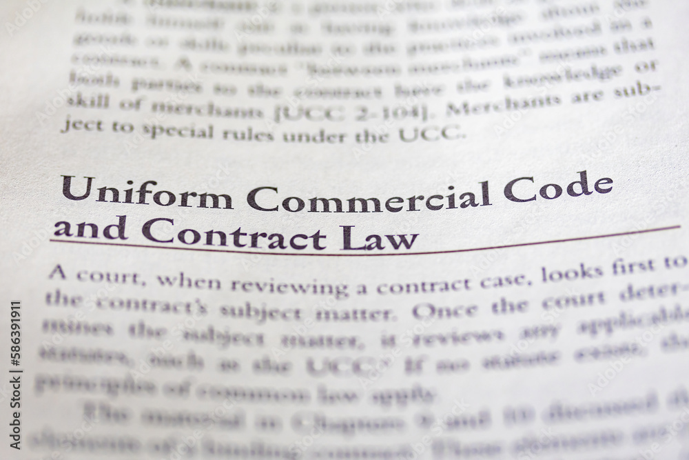 Fototapeta premium uniform commercial code UCC and contract law printed in text on page as visual aid or business law reference