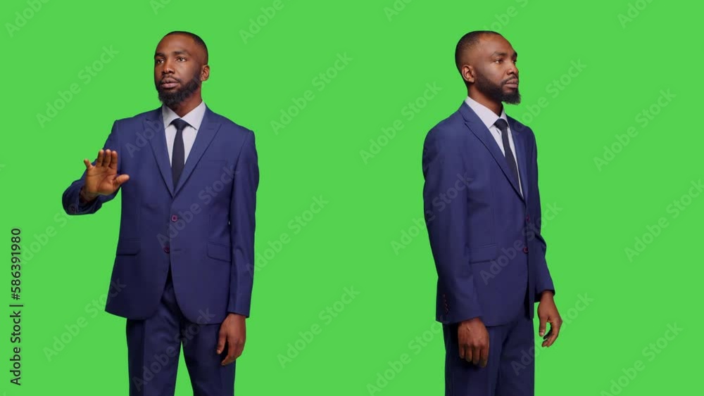 Company manager examining 3d holographic image in studio, working with holograms and artificial intelligence. Young adult wearing office suit, using holograph with augmented reality. Company manager examining 3d holographic image in studio, working with holograms and artificial intelligence. Young adult wearing office suit, using holograph with augmented reality.