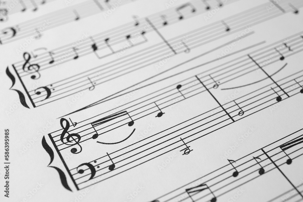 Sheet of paper with music notes as background, closeup view Sheet of paper with music notes as background, closeup view