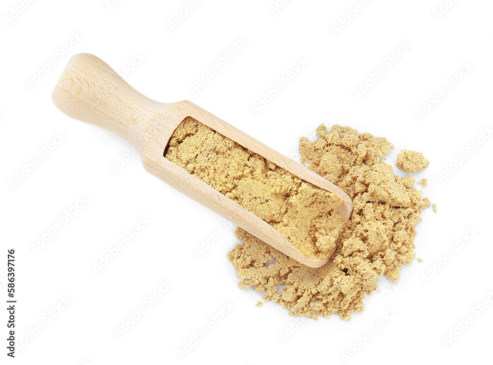 Wooden scoop with aromatic mustard powder on white background, top view Wooden scoop with aromatic mustard powder on white background, top view