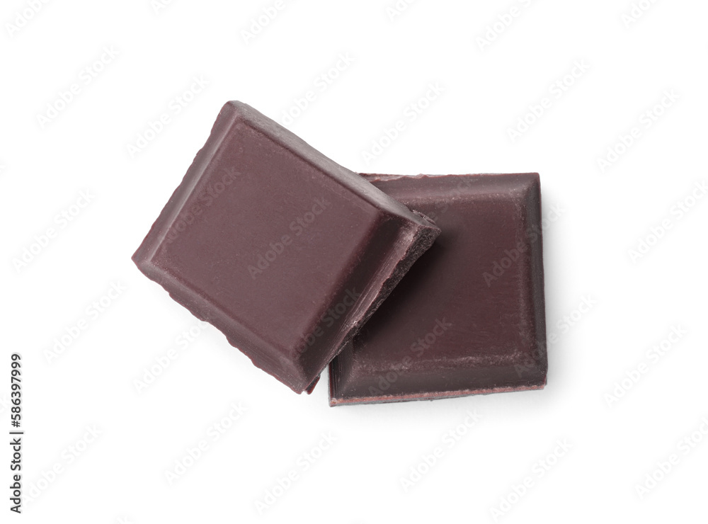 Pieces of delicious dark chocolate bar on white background, top view Pieces of delicious dark chocolate bar on white background, top view