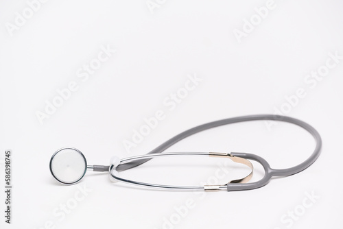 Medical gray stethoscope on white background and copy space for text.Medical or science with soft light background.Health care concept.