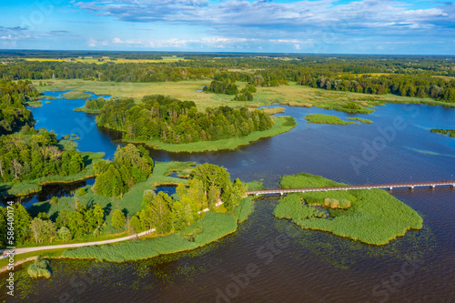 Wooden bridge over Sirvenos lake in Birzai, Lithuania photo