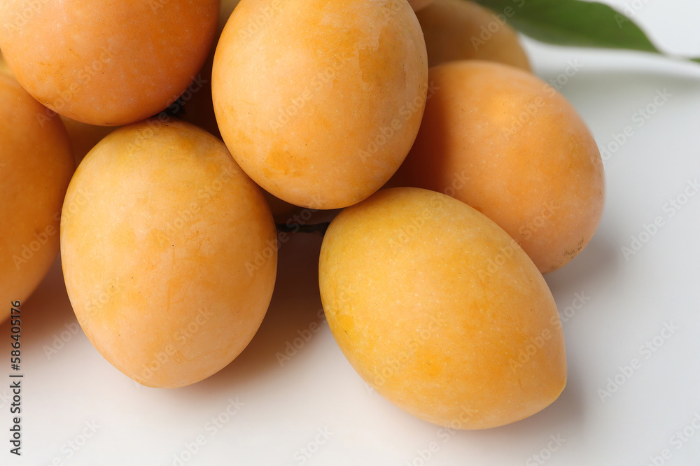 Fresh Marian Plum, (Bouea macrophylla Griffith), Ripe plum mango on white background. Fresh Marian Plum, (Bouea macrophylla Griffith), Ripe plum mango on white background.