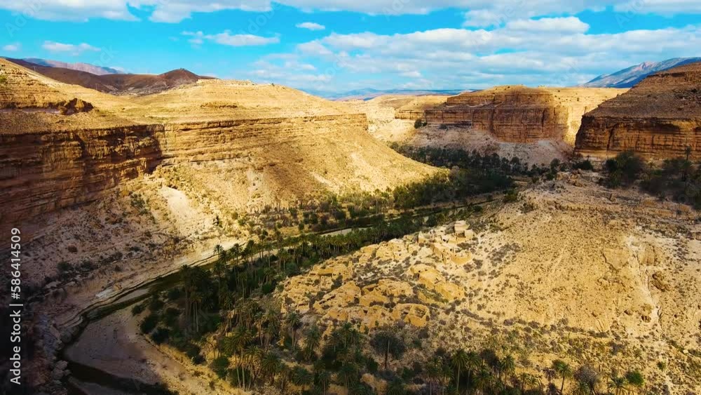 The Ghoufi canyon with the Abio river surrounded by palm trees. Biskra Algeria The Ghoufi canyon with the Abio river surrounded by palm trees. Biskra Algeria