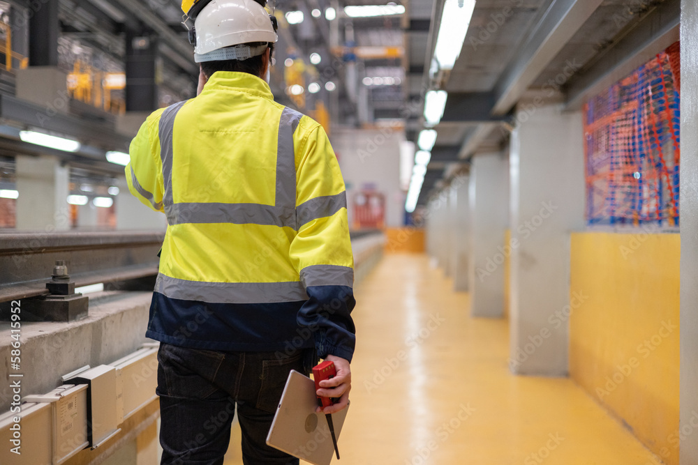 Obraz premium Project Engineer train Inspect the train's diesel engine, railway track in depot of train