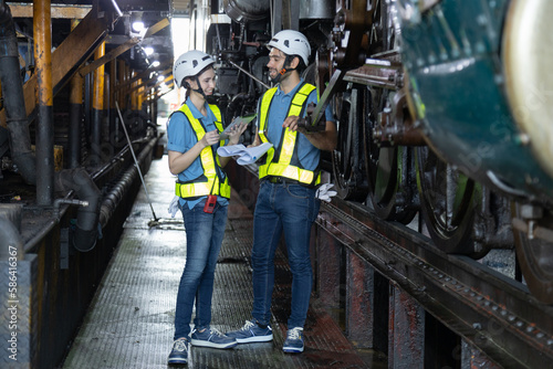 Engineer train Inspect the train's diesel engine, railway track in depot of train 