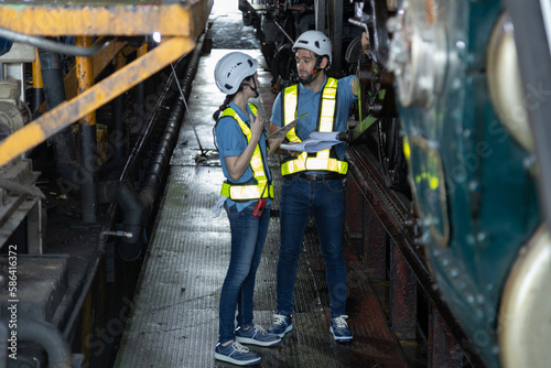 Engineer train Inspect the train's diesel engine, railway track in depot of train 