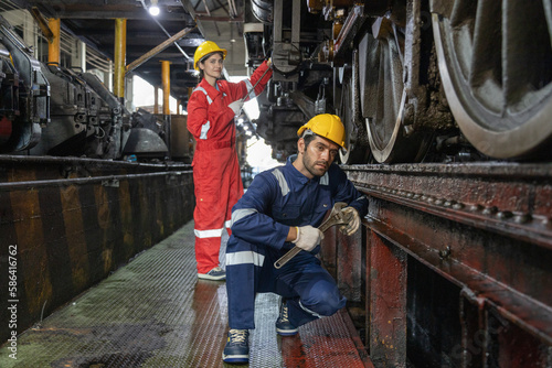 Engineer train Inspect the train's diesel engine, railway track in depot of train 