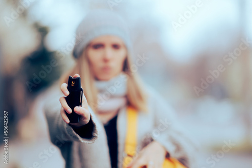 
Woman in Danger using Pepper Spray on a Criminal Attacker. Lady in self-defense scenario using tear gas on violent offender. 
 photo