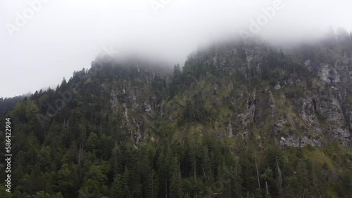 Aerial reveal view of Lake Lucerne Neuschwanstein Castle and the Swiss Alps