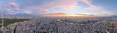 Beautiful view of famous Eiffel Tower in France with colorful twilight romantic sky. Wide establishing aerial morning sunrise or sunset of paris city center best travel destinations landmark in Europe © PixLOG