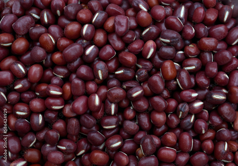 Adzuki beans in full frame. Japanese red beans pattern for background design. Adzuki beans in full frame. Japanese red beans pattern for background design.