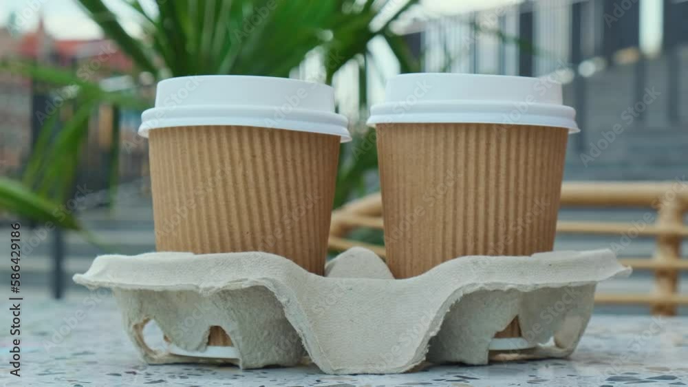 Female hand take Two paper cups with lid for tea to go. Coffee take ...