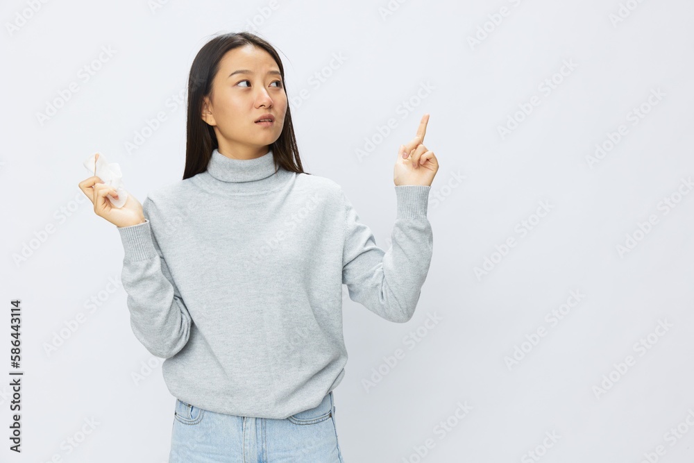 Asian woman holding hand with handkerchief and coughing up flu and cold, stuffy nose viral disease asthma and allergies covid, white background Asian woman holding hand with handkerchief and coughing up flu and cold, stuffy nose viral disease asthma and allergies covid, white background