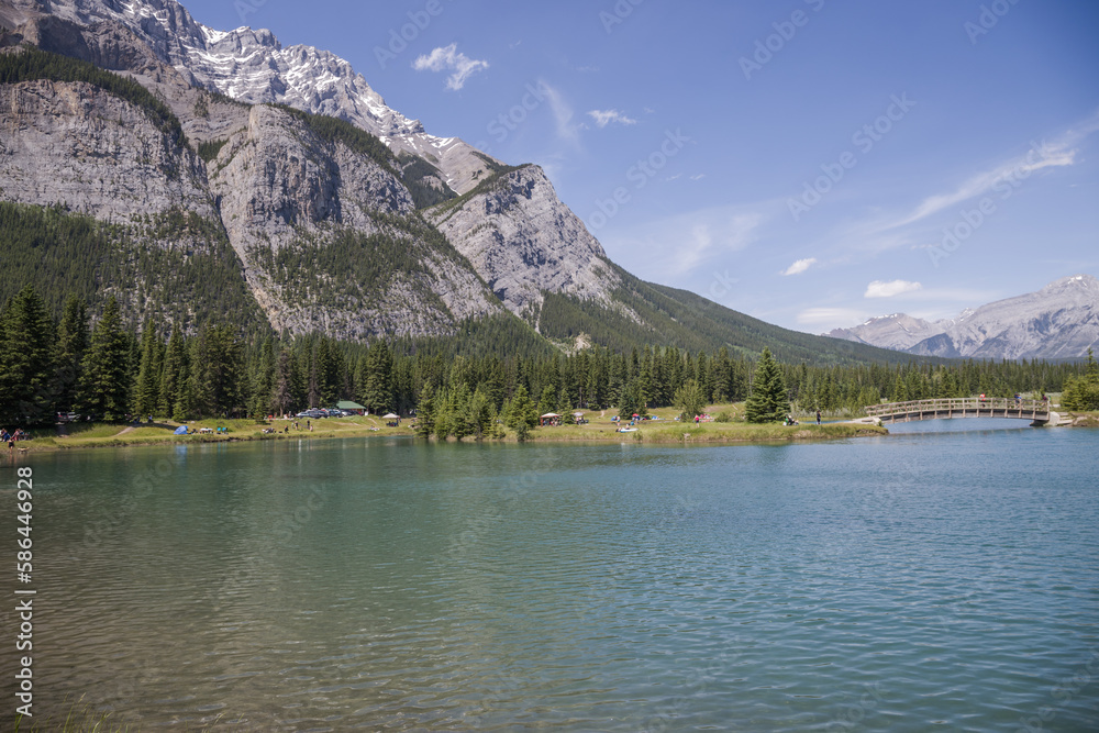 Canada landscape - Banff National Park, Alberta - summer travel to mountains, beautiful blue lake and coniferous forest.