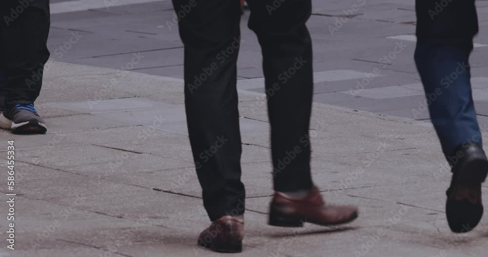 Pedestrians' Feet On A Busy Street, Close-Up Pedestrians' Feet On A Busy Street, Close-Up