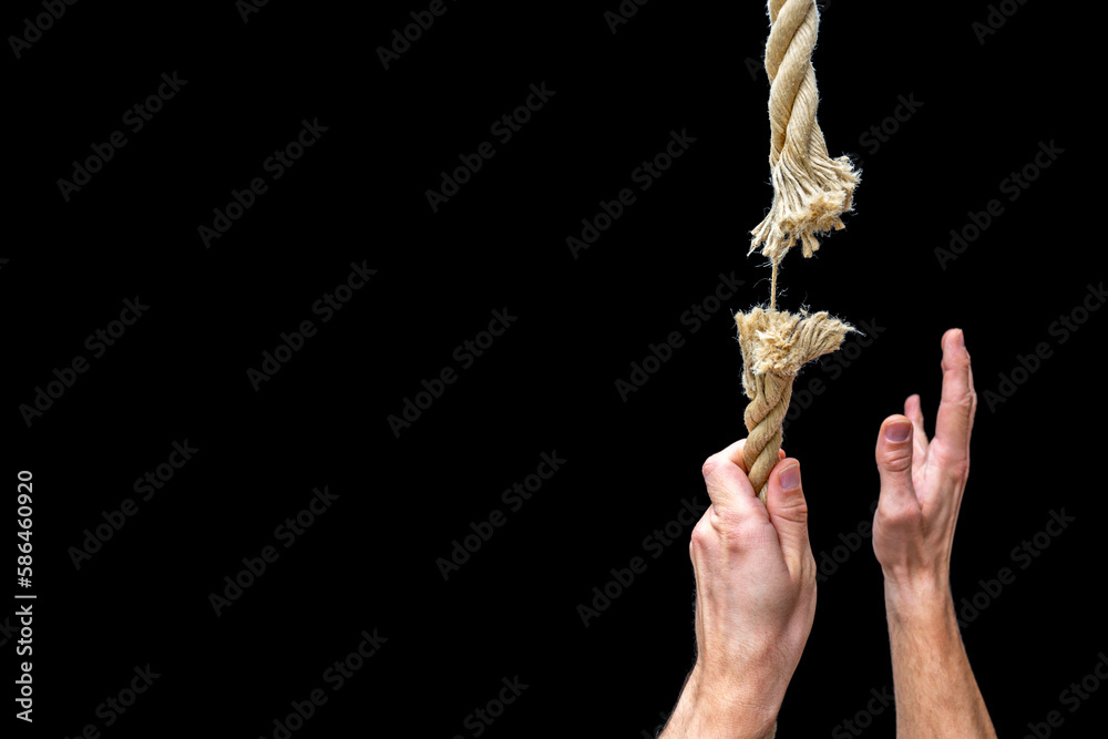 Person hängt an einem reißenden Seil als Symbol für Risiko - obrazy, fototapety, plakaty 