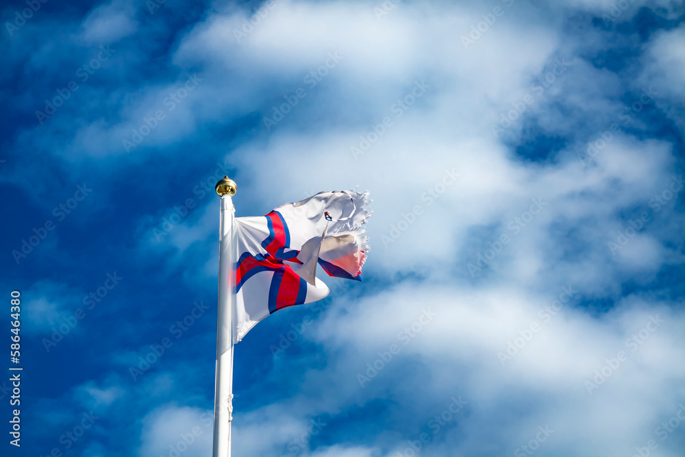 Flag of Faroe islands waving in the wind